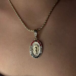 Brand new gold Virgin Mary necklace with colored stones.